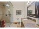 Well-appointed bathroom with a walk-in shower and granite vanity at 28940 Pinewood Vista Dr, Evergreen, CO 80439