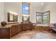 Luxurious bathroom with double vanity, large soaking tub, and walk-in shower at 28940 Pinewood Vista Dr, Evergreen, CO 80439