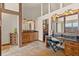 Spacious bathroom with double vanity and rustic wooden cabinets at 28940 Pinewood Vista Dr, Evergreen, CO 80439