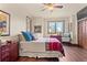 Cozy bedroom with a comfortable bed and plenty of natural light at 28940 Pinewood Vista Dr, Evergreen, CO 80439