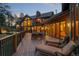 Relaxing deck with lounge chairs and access to the home's interior at 28940 Pinewood Vista Dr, Evergreen, CO 80439