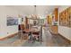 Elegant dining room with a large wooden table and kitchen views at 28940 Pinewood Vista Dr, Evergreen, CO 80439