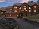 Stunning two-story home with a dramatic entryway and landscaped grounds at 28940 Pinewood Vista Dr, Evergreen, CO 80439
