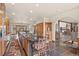 Open concept kitchen with an eat-in island and views to the living room at 28940 Pinewood Vista Dr, Evergreen, CO 80439
