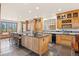 Gourmet kitchen featuring a large island, stainless steel appliances, and ample cabinetry at 28940 Pinewood Vista Dr, Evergreen, CO 80439