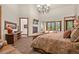 Main bedroom with a king-size bed, fireplace and private access to the balcony at 28940 Pinewood Vista Dr, Evergreen, CO 80439