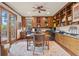 Home office with built-in shelves and large windows at 28940 Pinewood Vista Dr, Evergreen, CO 80439