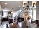 Dining room with views of the kitchen and stairwell, featuring a wooden table set at 4100 Albion St # 1509, Denver, CO 80216