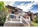 Charming home with a covered porch, featuring a brick facade and modern architectural elements at 4100 Albion St # 1509, Denver, CO 80216