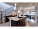 Bright kitchen island with granite countertops overlooking the dining and living room spaces at 4100 Albion St # 1509, Denver, CO 80216