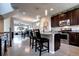 Modern kitchen island with granite countertops, stainless steel appliances, and bar stool seating at 4100 Albion St # 1509, Denver, CO 80216