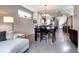 Open-concept living and dining area with modern furnishings and natural light at 4100 Albion St # 1509, Denver, CO 80216