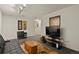 Finished basement with black leather seating, stylish decor, and a large television for entertainment at 1503 W Briarwood Ave, Littleton, CO 80120