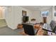 Cozy basement featuring a sitting area with modern furniture and a window for natural light at 1503 W Briarwood Ave, Littleton, CO 80120