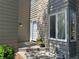 Inviting entryway with a stone wall, bay window, and a stylish front door at 1503 W Briarwood Ave, Littleton, CO 80120