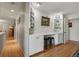 Hallway with built-in desk, cabinets, and two stools at 1503 W Briarwood Ave, Littleton, CO 80120