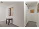 Hallway with decor, table and sliding barn door adds character and charm to the home's interior at 1503 W Briarwood Ave, Littleton, CO 80120