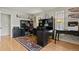 Inviting home office with natural light, organized workspaces and hardwood flooring at 1503 W Briarwood Ave, Littleton, CO 80120