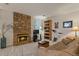 Comfortable living room with stone fireplace and ample seating at 1503 W Briarwood Ave, Littleton, CO 80120