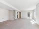 A finished basement with a walkout, carpet, and an additional room at 19368 E Quincy Pl, Aurora, CO 80015