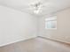 A bright bedroom with a ceiling fan and a window with blinds at 19368 E Quincy Pl, Aurora, CO 80015