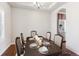 Elegant dining room with a large wood table set for a meal, next to the kitchen area at 19368 E Quincy Pl, Aurora, CO 80015