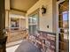 Charming front porch with stone accents and updated lighting fixtures, creating a warm and inviting entrance at 19368 E Quincy Pl, Aurora, CO 80015