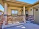 Inviting front porch with stone accents, providing a cozy and welcoming entrance to the home at 19368 E Quincy Pl, Aurora, CO 80015