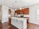 Stylish kitchen featuring a center island, stainless steel appliances, and hardwood floors for cooking at 19368 E Quincy Pl, Aurora, CO 80015