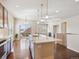 Bright, open kitchen with stainless appliances, hardwood floors and a spacious island at 19368 E Quincy Pl, Aurora, CO 80015