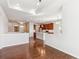 Open-concept living space with hardwood floors connecting to a modern kitchen at 19368 E Quincy Pl, Aurora, CO 80015