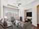 Inviting living room featuring a fireplace, large windows, and comfortable seating at 19368 E Quincy Pl, Aurora, CO 80015