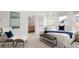 Bright bedroom with contemporary decor, carpet, and an ensuite bathroom at 2314 S University Blvd, Denver, CO 80210