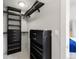 Walk-in closet with custom black shelving, drawers, and ample storage space at 2314 S University Blvd, Denver, CO 80210