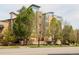 Stylish multi-story building with landscaped exterior, complemented by mature trees, and a modern design at 2314 S University Blvd, Denver, CO 80210