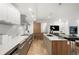 Contemporary kitchen design with an island, stainless steel appliances, and a built-in fireplace for added comfort at 2314 S University Blvd, Denver, CO 80210