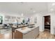 Spacious open-concept kitchen featuring an island, modern cabinetry, and hardwood flooring at 2314 S University Blvd, Denver, CO 80210