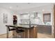 Modern kitchen with island featuring stainless steel appliances and ample storage at 2314 S University Blvd, Denver, CO 80210