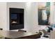 Living area with fireplace and adjacent dining area at 2314 S University Blvd, Denver, CO 80210
