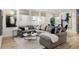 Spacious living room featuring a comfortable sectional sofa, lots of windows, and contemporary decor at 2314 S University Blvd, Denver, CO 80210