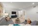 Modern living room features neutral colors, stylish furniture and bright lighting at 2314 S University Blvd, Denver, CO 80210