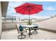 Cozy patio with seating and umbrella, offering a relaxed outdoor experience at 2314 S University Blvd, Denver, CO 80210