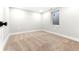 Finished basement bedroom with neutral carpeting and a window at 1070 W Oxford Ave, Englewood, CO 80110