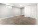 Finished basement room with neutral walls and white closet doors at 1070 W Oxford Ave, Englewood, CO 80110