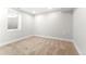 Finished basement room with neutral carpeting and a window at 1070 W Oxford Ave, Englewood, CO 80110
