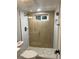 Modern bathroom with a walk-in shower and pebble floor at 1070 W Oxford Ave, Englewood, CO 80110
