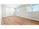 Well-lit bedroom with light wood floors and a large closet at 1070 W Oxford Ave, Englewood, CO 80110