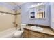 Bathroom featuring a shower and tub combo, sink, medicine cabinet and blue walls at 3663 S Sheridan Blvd # 14, Denver, CO 80235