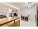 Dining area featuring table and chairs next to an island and living room at 3663 S Sheridan Blvd # 14, Denver, CO 80235
