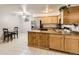 Eat in kitchen with a kitchen island, refrigerator, oven, cabinets and table and chairs at 3663 S Sheridan Blvd # 14, Denver, CO 80235